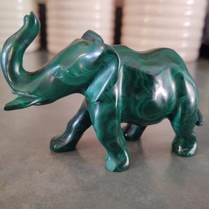 2 stone elephant figurines